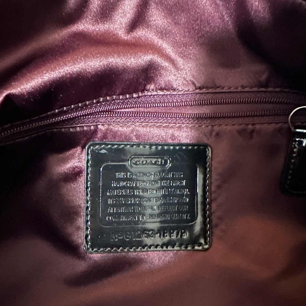 Coach bag very deep.  Deep enough for a laptop.